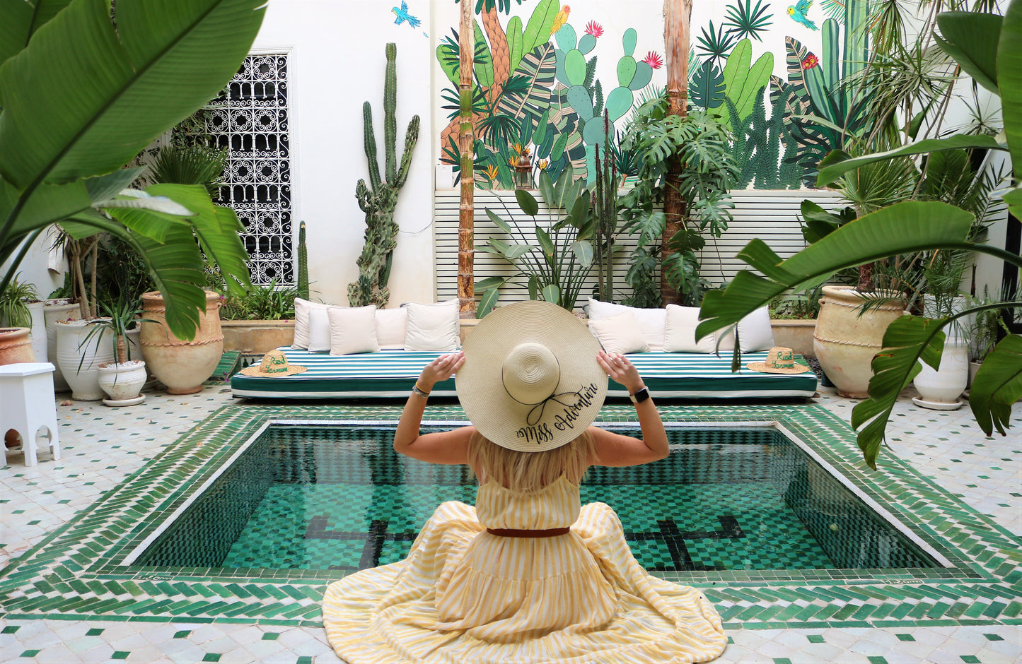 Woman with a hat in a traditional riad in Marrakesh